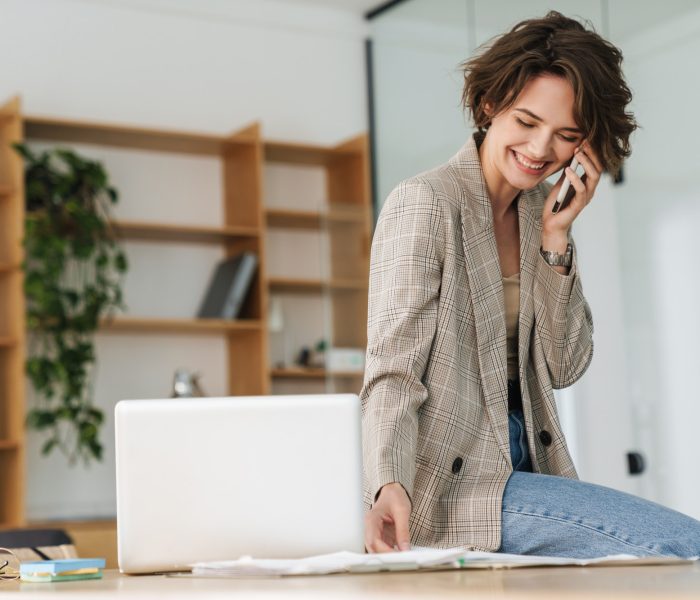 Attractive young businesswoman wearing jacket